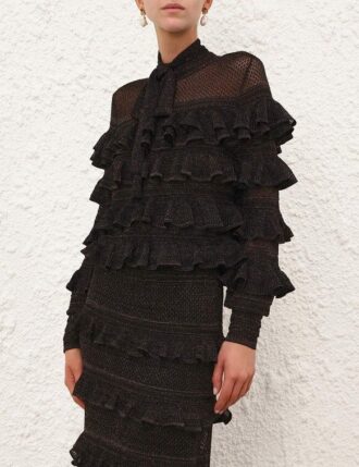 Top con volant e collo annodato Rebellion in nero metallizzato online