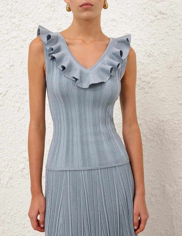 Top con volant metallizzati Aster in blu metallizzato online Top con volant metallizzati Aster in blu metallizzato online